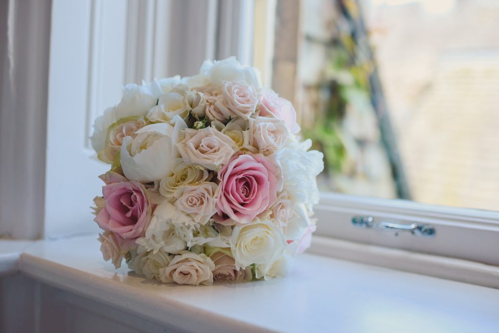 Bouquet of flowers on window sill