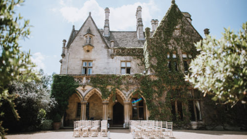 outdoor ceremony at the manor arches at manor by the lake