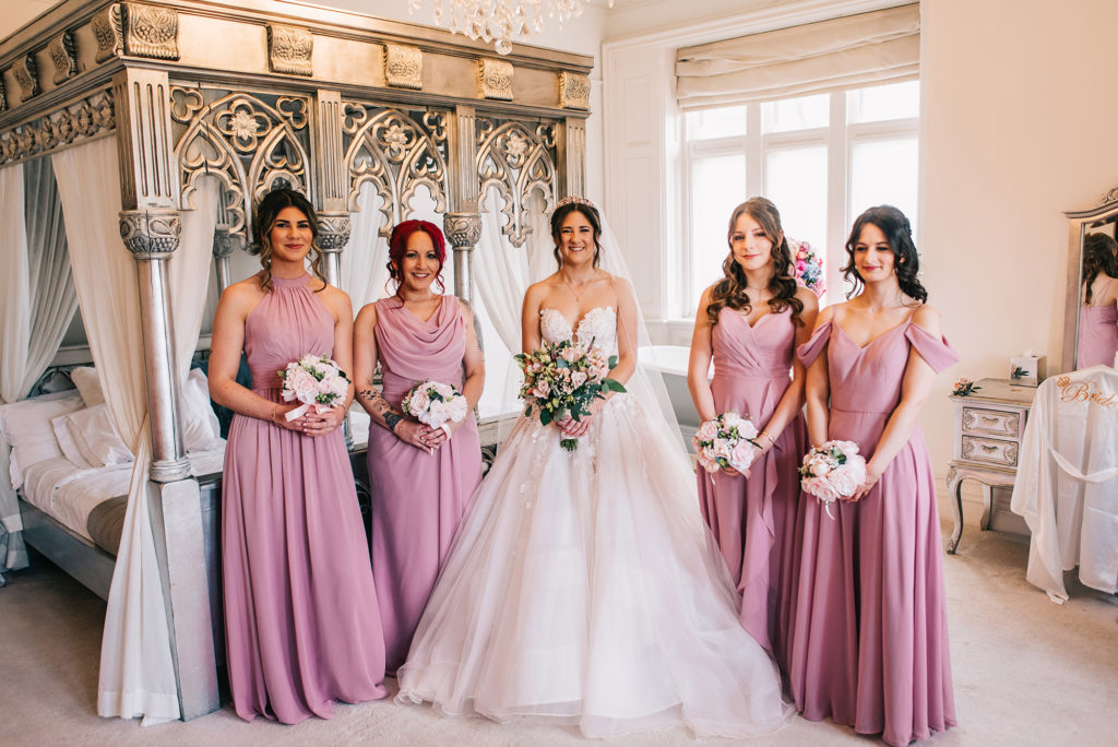 Bride with her bridesmaids in the honeymoon suite