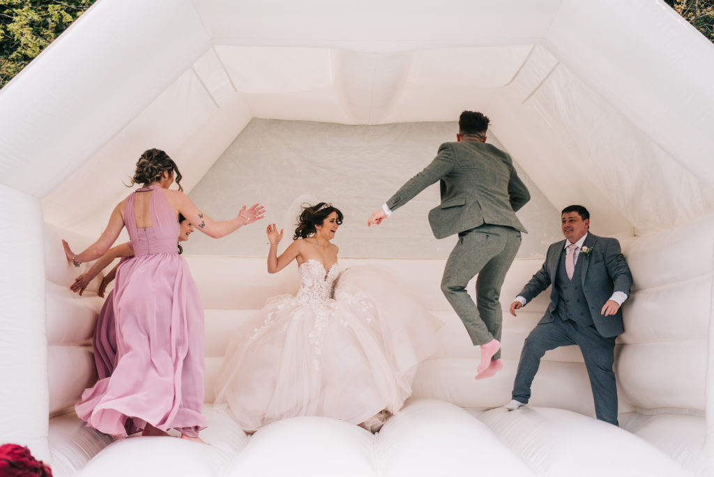 Bride & Groom on bouncy castle