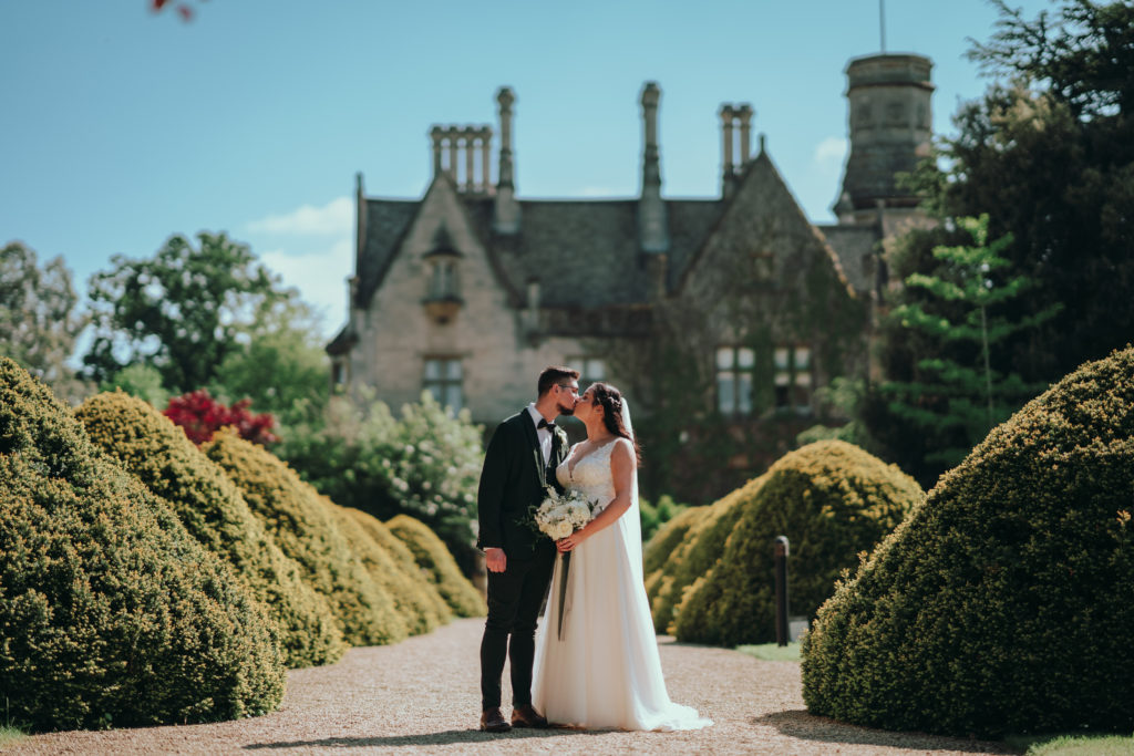 Couple kissing on Yew Tree walk at Manor By The Lake